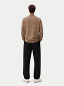 back view of a Man wearing a brown sweater and black pants on a white background #color_taupe