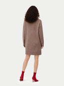 back view of woman wearing a brown sweater dress on a white background  #color_taupe