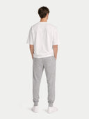 back view of a Person wearing a white t-shirt and gray sweatpants on a white background #color_vapor-blue