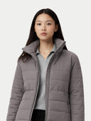Woman wearing a gray puffer jacket on a white background #color_dim-gray