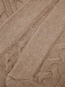 a zoomed in shot of a beige blanket #color_taupe