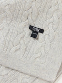 close up of a gray knit blanket with a brand label "GOBI"