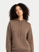 Woman wearing a brown hoodie against a white background #color_taupe