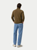 back view of a man wearing a brown sweater and blue pants on a white background #color_cub