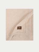 Beige blanket with a 'GOBI' label on a light beige background #color_beige