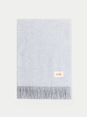Light blue woven scarf with a visible brand label on a white background #color_high-rise