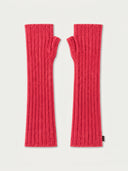 A pair of bright pink ribbed knit fingerless arm warmers laid flat on a light off-white background.