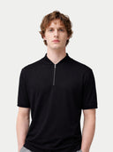 Man wearing a black polo shirt with a zipper on a white background #color_black