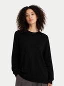 Front-view of a woman wearing a black sweater against a white background #color_blue-graphite