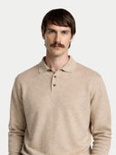 Man wearing a beige long-sleeve polo shirt against a white background #color_warm-grey