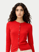 Woman wearing a red cardigan against a white background #color_red