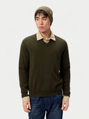 Model wearing the Unisex Seamless Cashmere Logo-Patch Beanie in Muted Green, full-length front view