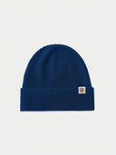 The Unisex Seamless Cashmere Logo-Patch Beanie in Deep Blue, flat lay front view