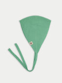 Green knitted bonnet with a strap on a white background #color_zephyr-green
