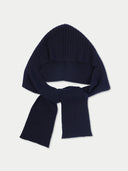A dark navy blue ribbed knit bonnet hat with a matching scarf tied around the neck, displayed on a light gray background.