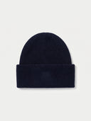The Women's Seamless Cashmere Ribbed Beanie in Navy, flat lay front view