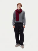 Model wearing the Cashmere Classic Knitted Scarf in Wine Red, full-length front view
