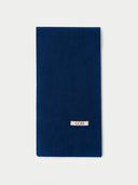 The Cashmere Classic Knitted Scarf in Deep Blue, flat lay front view