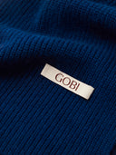 The Cashmere Classic Knitted Scarf in Deep Blue, close-up of the cashmere knit