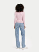 back view of a person wearing a pink sweater and light blue jeans on a white background #color_almond-blossom