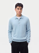 Model wearing the Essential Cashmere Polo Sweater in Muted Blue, front view