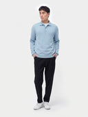 Model wearing the Essential Cashmere Polo Sweater in Muted Blue, full-length front view