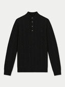 A black cable-knit mock-neck sweater with a three-button placket, displayed flat against a light gray background.