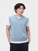 Model wearing the Essential Cashmere V-Neck Vest in Muted Blue, front view
