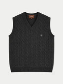 A dark charcoal gray cable-knit sweater vest with a V-neck, shown flat against a light gray background. A small embroidered crest logo is visible on the left chest, and a brown brand label reading 'GOBI' is visible inside the collar.