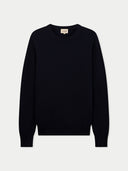 flat lay of a dark navy crew neck sweater on a light gray background #color_navy-blazer