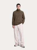 Timeless Cashmere Turtleneck Sweater in Olive Green, worn by a model