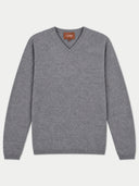 A gray v-neck knit sweater with long sleeves, laid flat against a light gray background. A small brown brand label reading GOBI is visible at the inner collar.