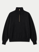 A black long-sleeve quarter-zip sweater with a gold zipper pull, displayed flat against a light gray background.