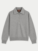 A light gray knit polo sweater with a three-button placket, laid flat against a light gray background. The brand label 'GOBI' is visible on the inner collar.