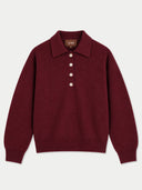 A burgundy knit polo sweater with a three-button placket, laid flat against a light gray background. The brand name 'GOBI' is visible on the inner neck label.