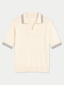 A cream-colored ribbed knit polo shirt with gray and white striped trim on the collar and sleeve cuffs, displayed against a light gray background.