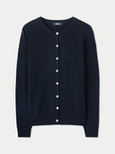 Black cardigan with white buttons on a light gray background #color_black