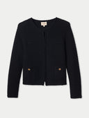 Black elegant textured cardigan with gold buttons on side pockets on a light gray background #color_black