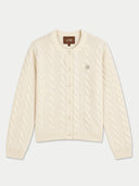 An off-white cable-knit cardigan sweater with a button-up front, ribbed collar, cuffs, and hem, featuring a small embroidered logo on the left chest. The brand name 'GOBI' is visible on the inner neck label.