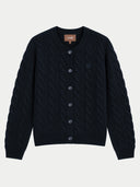A dark navy blue cable-knit cardigan sweater with a button-up front, ribbed collar, cuffs, and hem, featuring a small embroidered logo on the left chest and a visible GOBI brand label inside the neckline.
