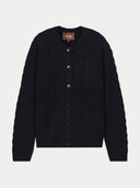 A black cable-knit cardigan sweater with a button-up front, displayed flat against a light gray background. A brown brand label reading 'GOBI' is visible inside the collar.