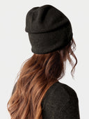 Model wearing the Cashmere Fine-Knit Crewneck Sweater in Olive Brown, back view