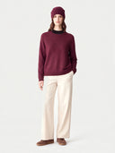 Model wearing the Cashmere Fine-Knit Crewneck Sweater in Wine Red, full-length front view