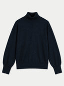 A dark navy blue knit turtleneck sweater with balloon sleeves, shown flat against a light gray background.