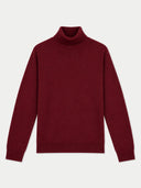 A dark burgundy knit turtleneck sweater with long sleeves, displayed flat against a light gray background.