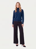 Model wearing the Cashmere Classic Turtleneck Sweater in Deep Blue, full-length front view