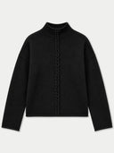 A black long-sleeve knit top with a mock neck and a central braided detail running down the front, displayed on a light gray background.