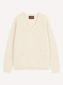 An off-white V-neck knit sweater with long sleeves, laid flat against a light cream background. A small brown brand label reading 'GOBI' is visible at the inner collar.