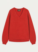 A bright red long-sleeve V-neck sweater with a relaxed fit, laid flat against a light off-white background. The brand label 'GOBI' is visible inside the neckline.