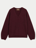 A burgundy V-neck knit sweater with long balloon sleeves, laid flat against a light gray background. The brand label 'GOBI' is visible inside the collar.